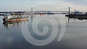 Aerial video flying low on the Delaware River Towards Walt Whitman Bridge Philadelphia