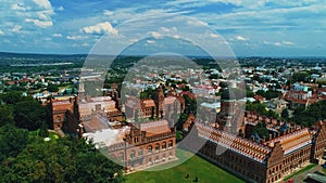 Aerial video of green summer city with view on Chernivtsi National Yurii Fedkovych University.