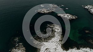 Aerial video of kayaking among small tiny islands during winter in lofoten islands. Recreational sport. aerial overflight video of