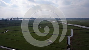 Aerial video of meadow in reclaimed land with second world war bunkers