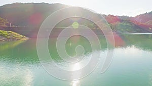 Aerial video of mountain lake and mountains at sunset