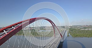 Aerial video photography of a large red Bugrinsky bridge