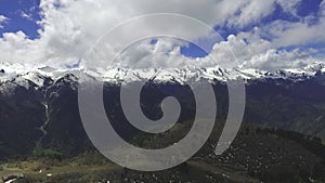 Aerial video from the quadcopter of the circular panorama of the mountains and Village of Mestia, Svaneti