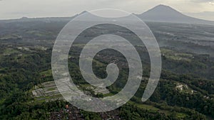 Aerial video of rice terraces in Tegalalang, Bali. View to volcano Agung