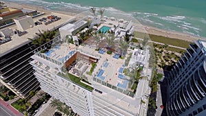 Aerial video of a rooftop pool and lounge