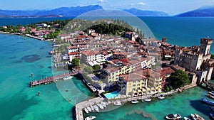 Aerial video of Sirmione village and castle, Garda lake, Italy