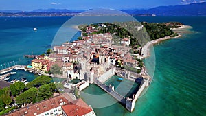 Aerial video of Sirmione village and castle, Garda lake, Italy