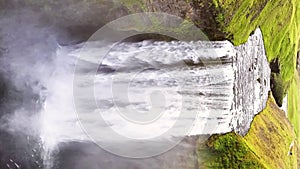 aerial video of Skogafoss waterfall. South Iceland. Epic Drone. Aerial vertical, vertical video background.