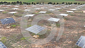 Aerial video of a solar farm with separate mobile solar panels. Renewable energy