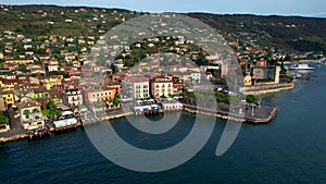 Aerial video of Torri del Benaco village and castle, Garda lake, Italy