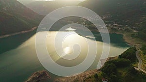 Aerial video. View of the beautiful blue mountain lake. Piva lake