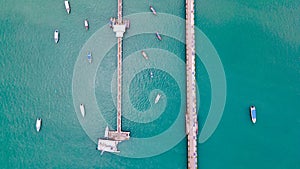 Aerial view of 2 bridges with boats anchored at Chalong Pier