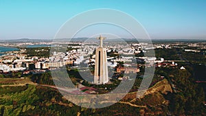 Aerial view The 25 de Abril Bridge and The Sanctuary of Christ monument
