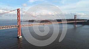 Aerial view of 25th April Bridge in Lisbon, Portugal. Famous landmark on river Tagus.