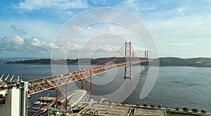 Aerial view of 25th April Bridge in Lisbon, Portugal. Famous landmark on river Tagus.