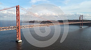 Aerial view of 25th April Bridge in Lisbon, Portugal. Famous landmark on river Tagus.