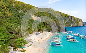 Aerial view of 7 Commando Beach on paradise island, tropical travel destination, El Nido, Palawan, Philippines