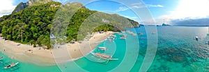 Aerial view of 7 Commando Beach on paradise island, tropical travel destination, El Nido, Palawan, Philippines