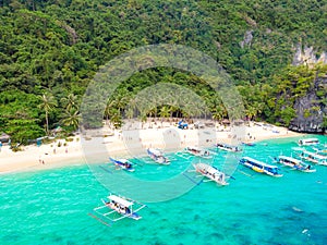 Aerial view of 7 Commando Beach on paradise island, tropical travel destination, El Nido, Palawan, Philippines