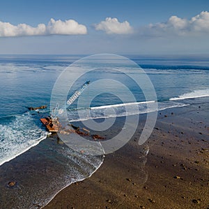 Aerial view of abandoned construction crane over the sea