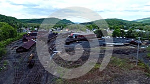 Aerial View of an Abandoned Narrow Gauge Coal Rail Road with Rusting Hoppers and Freight Cars