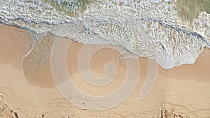 Aerial view from above down Drone shot. Beautiful tropical beach sea with white sand. Top view. Empty and clean beach in