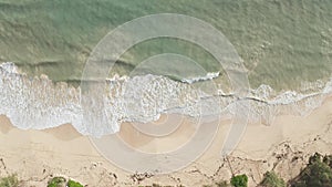 Aerial view from above down Drone shot. Beautiful tropical beach sea with white sand. Top view. Empty and clean beach in