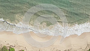 Aerial view from above down Drone shot. Beautiful tropical beach sea with white sand. Top view. Empty and clean beach in