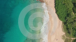 Aerial view from above down Drone shot. Beautiful tropical beach sea with white sand. Top view. Empty and clean beach in