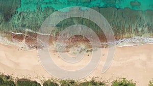 Aerial view from above down Drone shot. Beautiful tropical beach sea with white sand. Top view. Empty and clean beach in