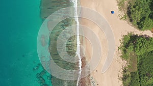 Aerial view from above down Drone shot. Beautiful tropical beach sea with white sand. Top view. Empty and clean beach in