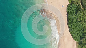 Aerial view from above down Drone shot. Beautiful tropical beach sea with white sand. Top view. Empty and clean beach in