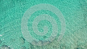 Aerial view from above down Drone shot. Beautiful tropical beach sea with white sand. Top view. Empty and clean beach in