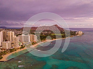 Aerial view from above on the Honolulu city skyline and the Purple Diamond head volcano