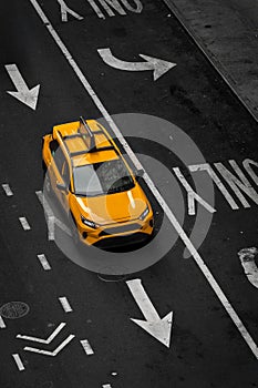 Aerial view above a New York yellow taxi cab on a city street