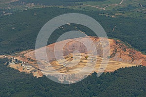 Aerial view from above of opencast mining quarry with lots of machinery at work.This area has been mined for copper, iron ore,