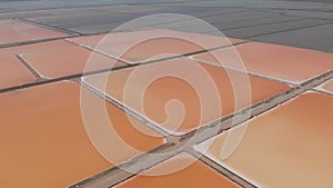 Aerial view above red Salt production pools in Albania, drone shot