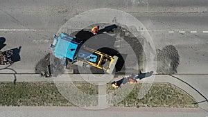 Aerial view above road construction worker view from drone