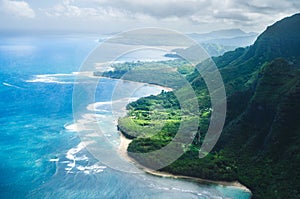 Aerial view of the abrupt and green Napali Coast in Kauai, US