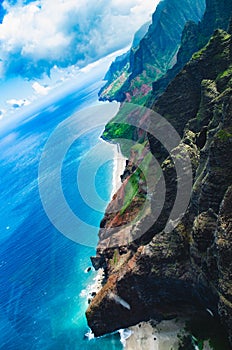 Aerial view of the abrupt and green Napali Coast in Kauai, US