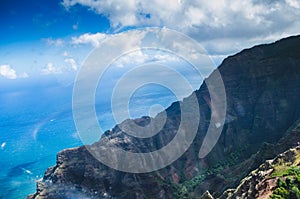 Aerial view of the abrupt and green Napali Coast in Kauai, US