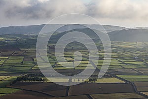 Aerial view on abstract pattern of fields at Serra do Cume and Serra da Ribeirinha before or after sunset or sunrise with low