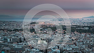 Aerial view of Acropolis and Athens city, sunset time lapse in Greece from the Lycabettus Hill