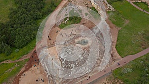 Aerial view of active geothermic geysir in highlands of Iceland. Drone view of touristic icelandic landmark with