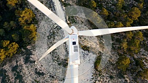 Aerial view of aeolian generators field in the top of a hill.