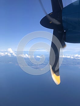 Aerial view from an aeroplane with blue sky and light cloud