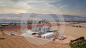 Aerial view of agricultural silos near the highway.