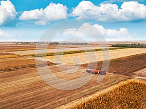 Aerial view of agricultural tractor in the field