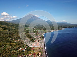Aerial view of Agung volcano in Bali. In background mountain Abang and volcano Batur. Beatiful view to landscape with sea. Highest photo
