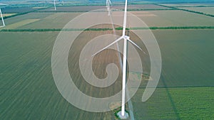 Aerial view of the air turbine in the middle of the cultivated field